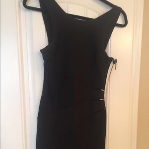 Bebe black dress with a side zipper size S Small